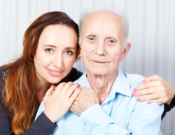 Caregiver hugging the elder