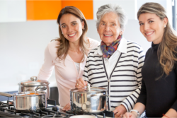 Caregivers and elder in the kitchen